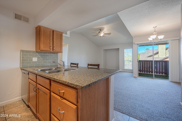 kitchen featuring stainless steel dishwasher, kitchen peninsula, sink, and ceiling fan with notable chandelier