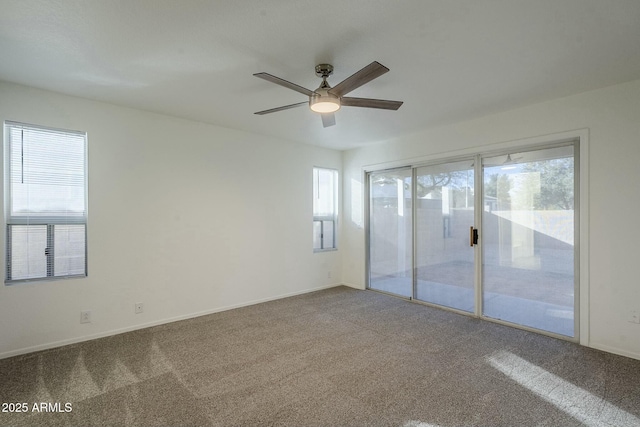 empty room featuring carpet flooring and ceiling fan