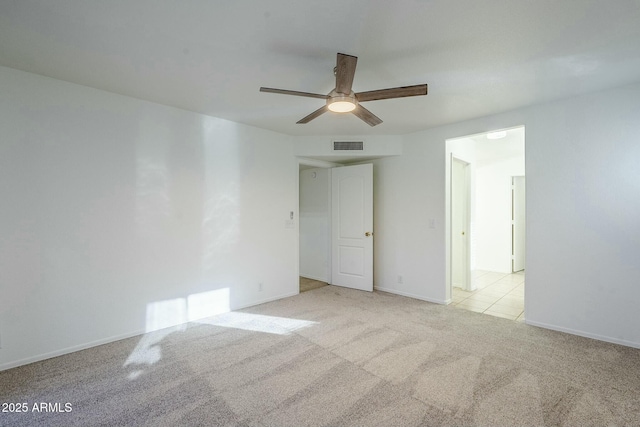 carpeted empty room with ceiling fan