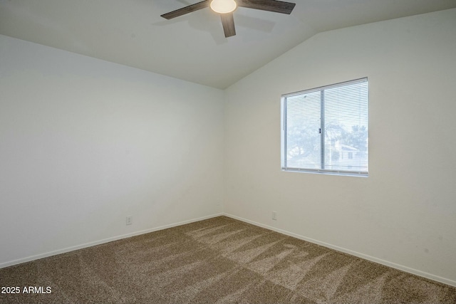 carpeted empty room with ceiling fan and vaulted ceiling