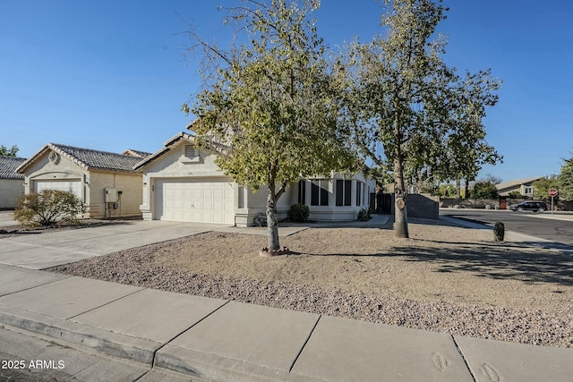 obstructed view of property with a garage