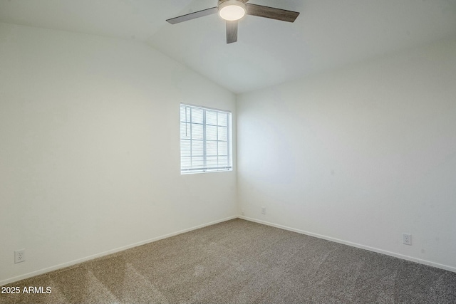 spare room featuring carpet flooring, ceiling fan, and lofted ceiling