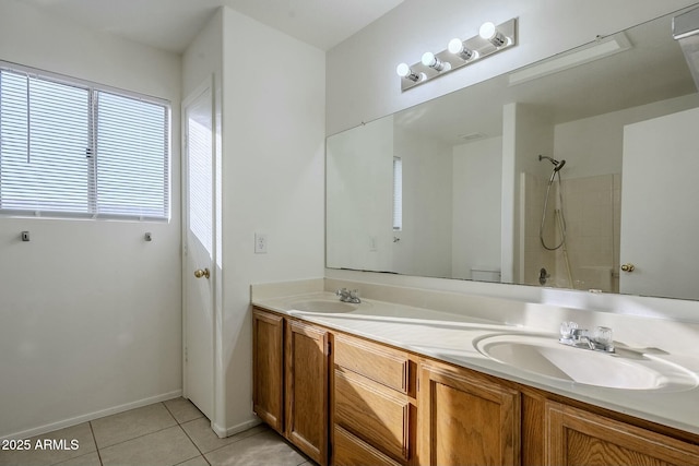 bathroom with bathing tub / shower combination, tile patterned flooring, and vanity