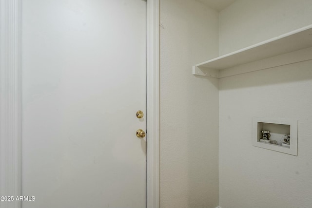 clothes washing area featuring washer hookup