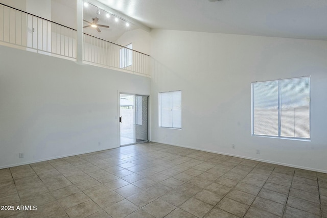 tiled spare room featuring beam ceiling, high vaulted ceiling, and ceiling fan