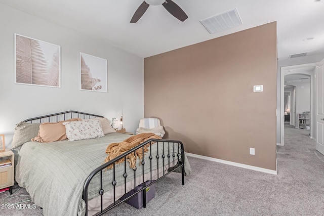 2499 S Entwistle St, Gilbert, AZ 85295 - carpeted bedroom with baseboards, ceiling fan, and arched walkways