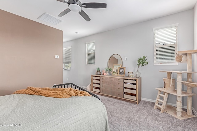 2499 S Entwistle St, Gilbert, AZ 85295 - bedroom with light carpet, ceiling fan, and baseboards