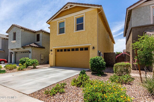 2499 S Entwistle St, Gilbert, AZ 85295 - view of front facade with stucco siding, an attached garage, concrete driveway, and a tile roof