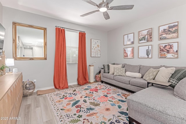 2499 S Entwistle St, Gilbert, AZ 85295 - living room with ceiling fan, light wood-type flooring, and baseboards