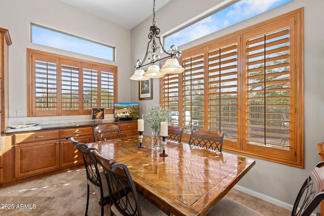 dining space with a notable chandelier and plenty of natural light