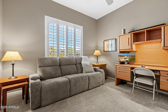 home office with ceiling fan and carpet floors