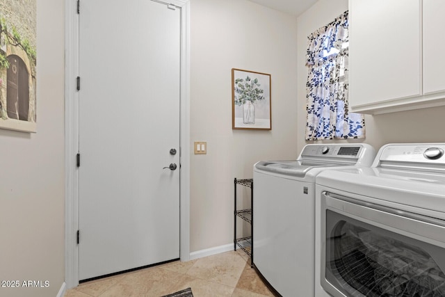 washroom featuring separate washer and dryer, light tile patterned flooring, and cabinets