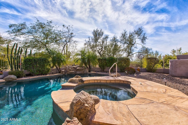 view of swimming pool featuring an in ground hot tub