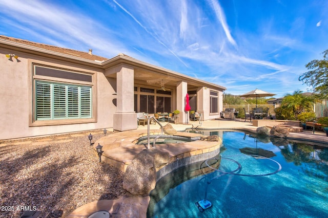 view of swimming pool with an in ground hot tub and a patio area