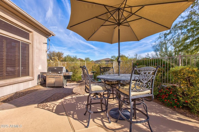 view of patio with a grill