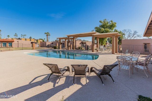 view of pool featuring a pergola and a patio