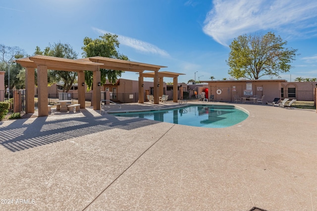 view of swimming pool featuring a patio area