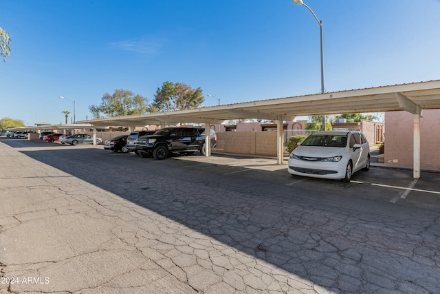 view of vehicle parking with a carport