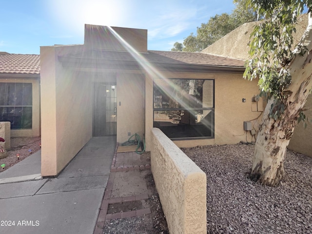 entrance to property with a patio area