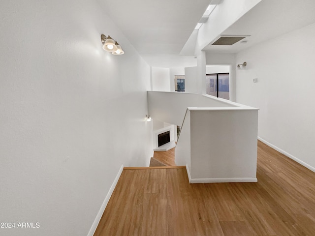 corridor featuring light hardwood / wood-style floors