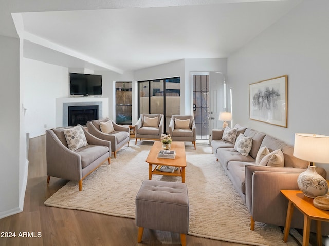 living room with baseboard heating and hardwood / wood-style floors