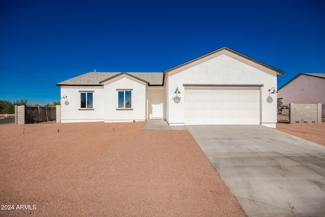 ranch-style home featuring a garage