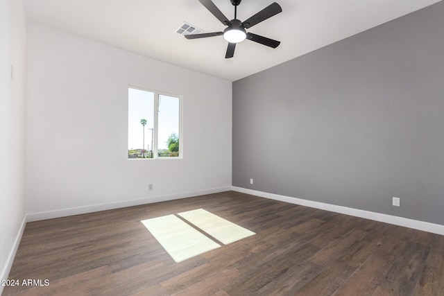 empty room with dark hardwood / wood-style floors and ceiling fan