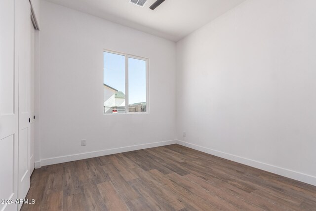 spare room featuring dark hardwood / wood-style flooring