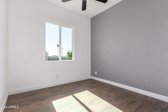 empty room featuring ceiling fan and dark hardwood / wood-style flooring