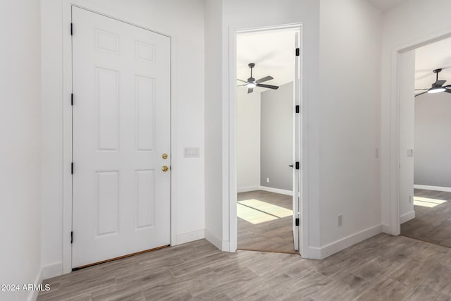 entrance foyer with ceiling fan and light hardwood / wood-style floors