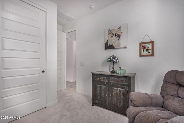 sitting room with light colored carpet