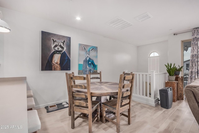 dining area with light hardwood / wood-style floors