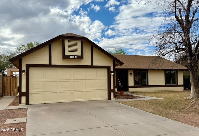 ranch-style home featuring stucco siding, an attached garage, driveway, and roof with shingles