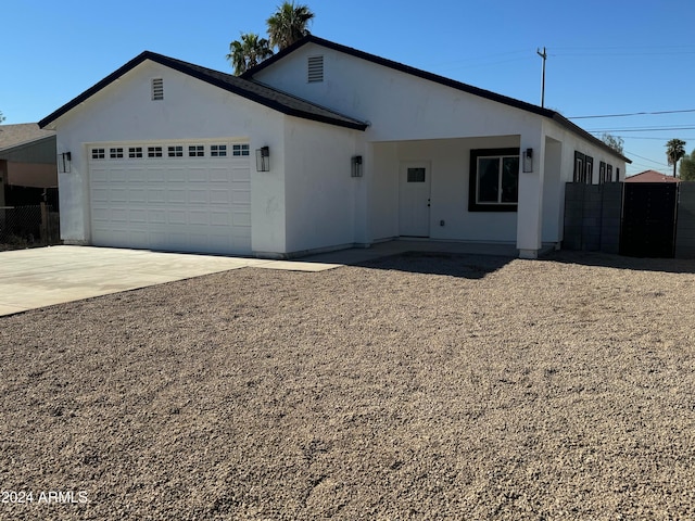 ranch-style home with a garage