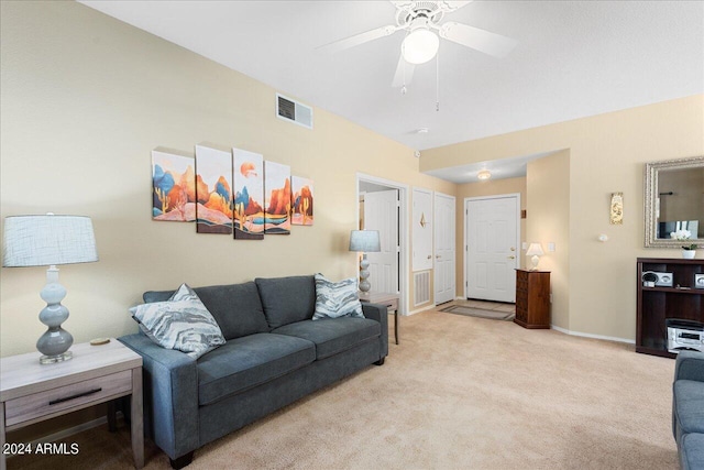 living room featuring light colored carpet and ceiling fan