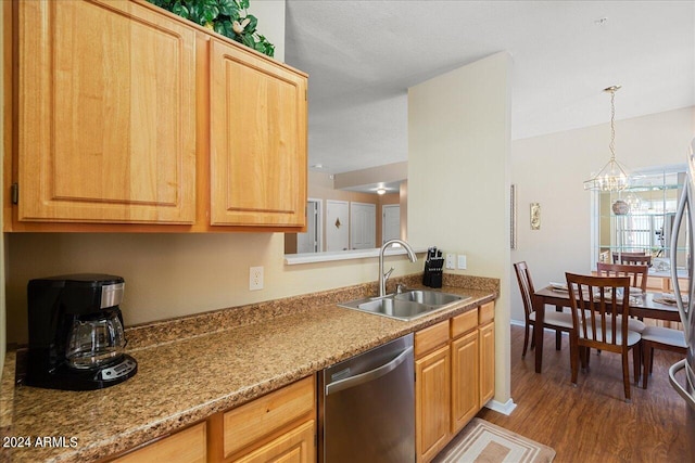 kitchen featuring dishwasher, light stone countertops, dark hardwood / wood-style flooring, sink, and an inviting chandelier