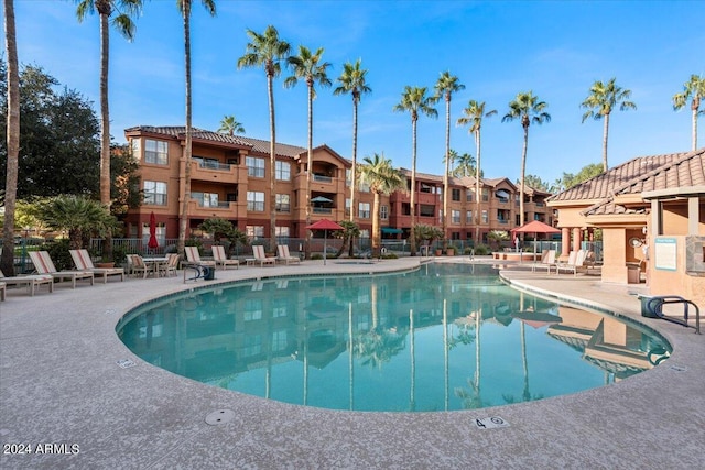 view of swimming pool featuring a patio area