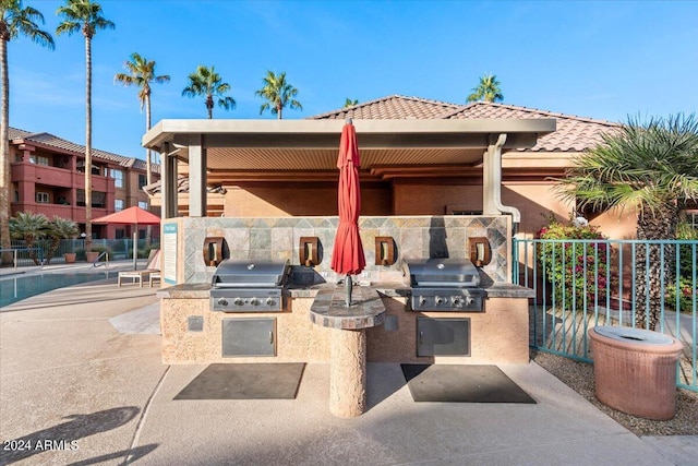 view of patio with a grill and area for grilling