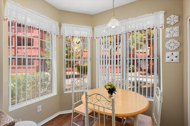 dining room with hardwood / wood-style flooring