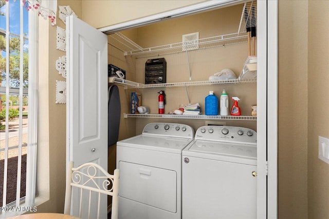 washroom featuring washing machine and dryer