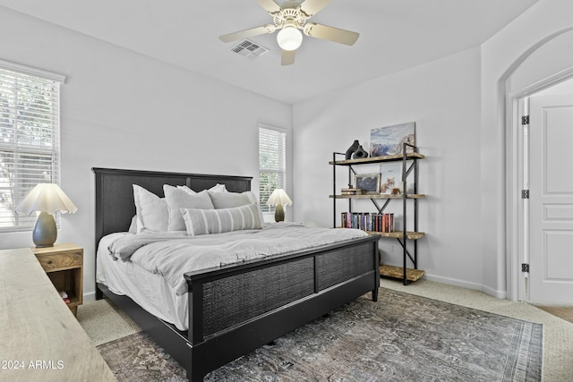 carpeted bedroom with ceiling fan