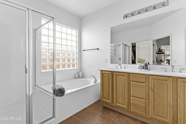 bathroom with separate shower and tub, tile patterned flooring, and vanity