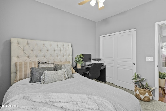 bedroom with ceiling fan and hardwood / wood-style floors