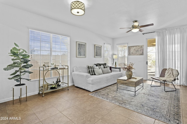 tiled living room featuring ceiling fan