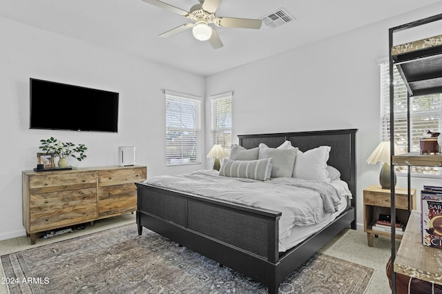 carpeted bedroom with ceiling fan