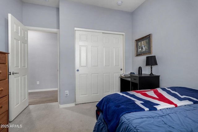 bedroom with a closet and carpet flooring