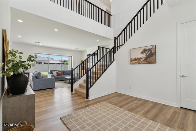 3919 W Abalone Ln, San Tan Valley, AZ 85144 - staircase featuring wood finished floors, baseboards, and recessed lighting