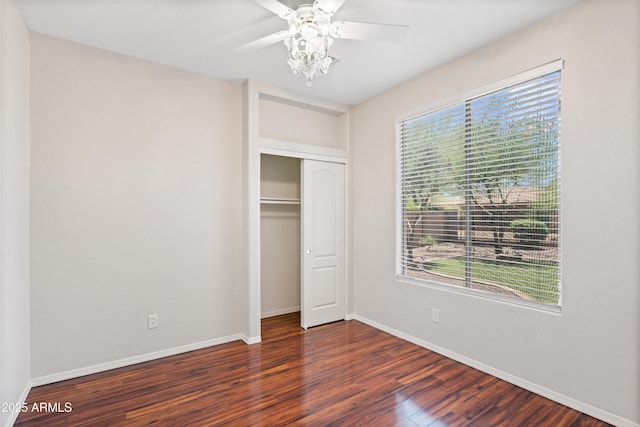 12727 W Lowden Rd, Peoria, AZ 85383 - unfurnished bedroom with wood finished floors, baseboards, a closet, and ceiling fan