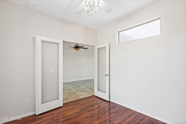 12727 W Lowden Rd, Peoria, AZ 85383 - spare room with a ceiling fan, dark wood-style floors, baseboards, and a smoke detector