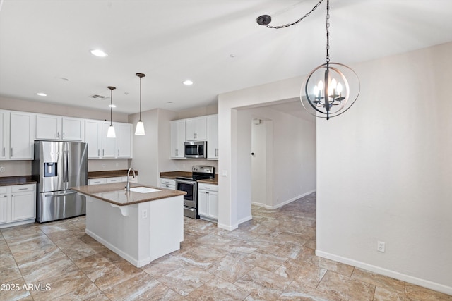 12727 W Lowden Rd, Peoria, AZ 85383 - kitchen featuring stainless steel appliances, a sink, white cabinets, a chandelier, and recessed lighting